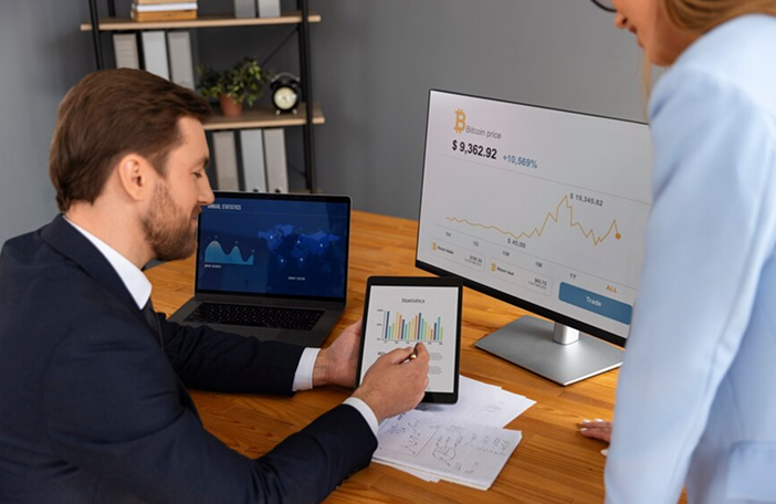 person-looking-finance-graphs_52683-116611 1